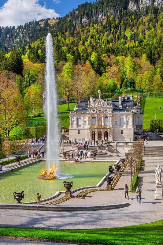 Water parterre with large fountain and portal of Linderhof Castle in spring, municipality of Ettal, Ammergau Alps, Ammertal, Upper Bavaria, Bavaria, Germany