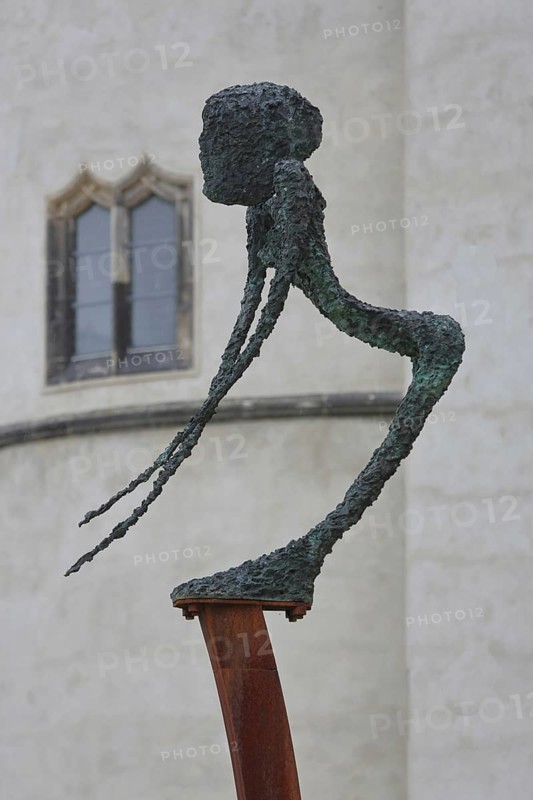 Sculpture Dying, Unbearable Lightness by Frank Seidel, modern art, bronze sculpture, dying, unbearable, painful, lightness, thin, slender, long, pointed, arms, body, castle park, castle meadow, Luther city Wittenberg, Fläming, Saxony-Anhalt, Germany
