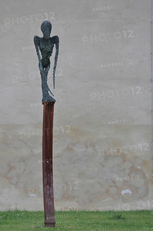 Sculpture, Dying, Unbearable Lightness by Frank Seidel, modern art, bronze sculpture, dying, unbearable, painful, lightness, thin, slender, long, pointed, arms, body, castle park, castle meadow, Luther city Wittenberg, Fläming, Saxony-Anhalt, Germany