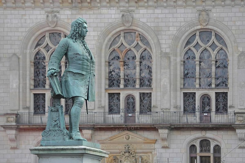 Sculpture Handel monument by Hermann Heidel 1859, George Frideric Handel, George with music stand, music stand and score, historical clothing, baroque, window of the neo-gothic town hall, Handel monument, market square, Halle an der Saale, Saxony-Anhalt, Germany