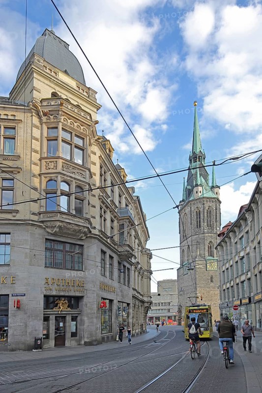 Kleinschmieden with tram tracks, and Red Tower on the market square, overhead lines, rails, tram, cyclist, pharmacy, Halle an der Saale, Saxony-Anhalt, Germany