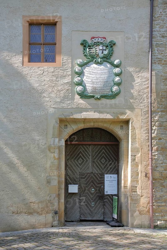 Entrance with coat of arms to the castle and museum, Lützen, Saxony-Anhalt, Germany