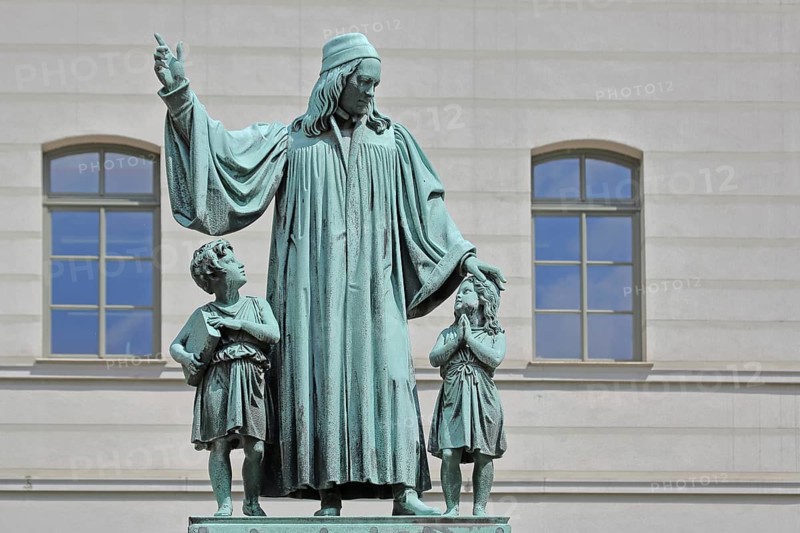 Monument to theologian, pedagogue and poet, August Hermann Francke, man with two children, protect, protect, care, gesture, arm, high, above, bless, hymn writer, interaction, Halle an der Saale, Saxony-Anhalt, Germany