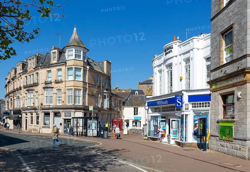Street and shops including WH Smith in town centre of Teignmouth, south Devon, England, UK