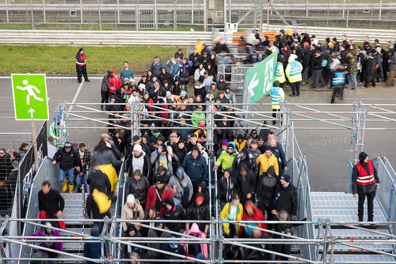 Festival visitors stream via separate entrances to the front breakwaters in front of the Utopia Stage at the Rock am Ring Festival on Sunday, Nürburgring race track race track, 08.06.2025