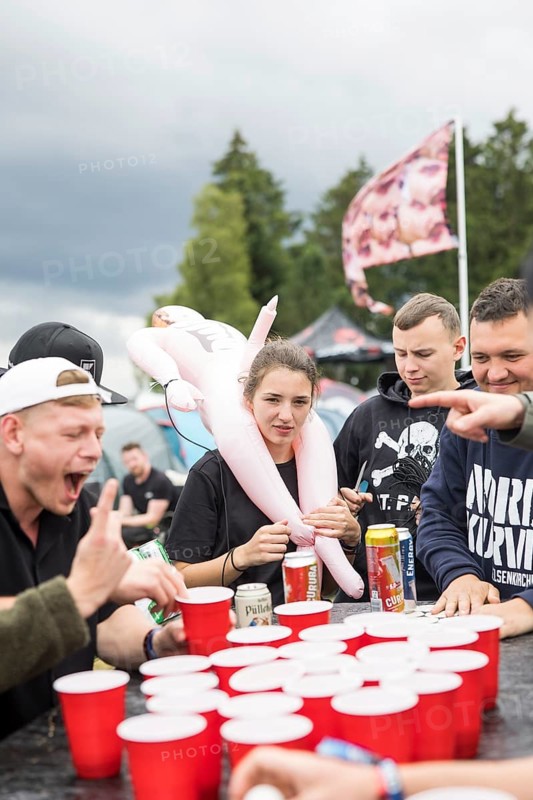 Festival visitors play a drinking game on a campsite at the Rock am Ring Festival on Saturday, Nürburgring race track race track, 07.06.2025