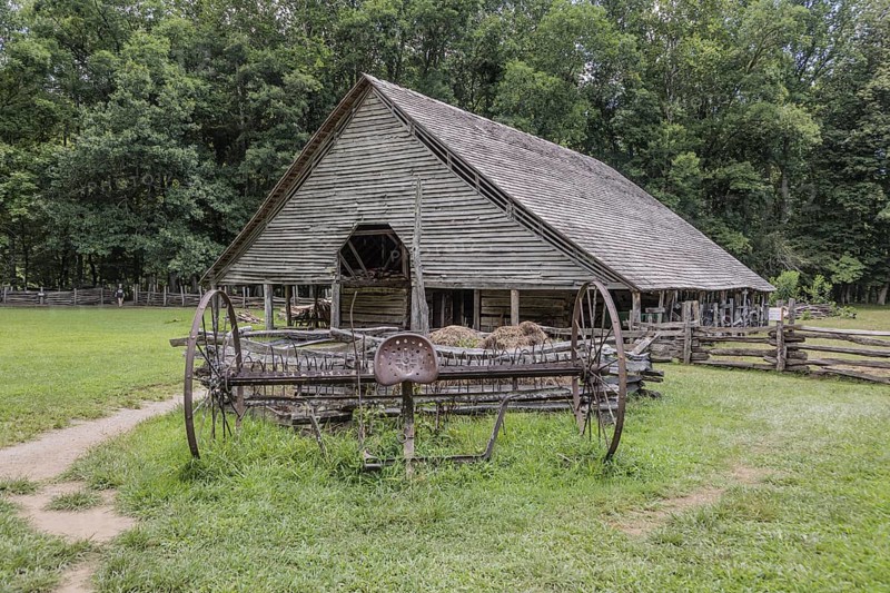 Historic log buildings at the Oconaluftee Visitor Center at Great Smoky Mountains National Park near Cherokee, North Carolina, USA