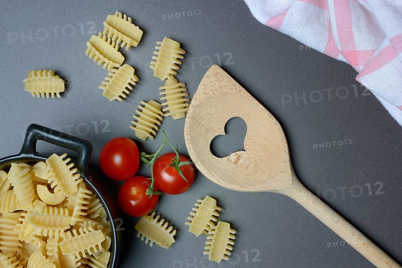 Cooking spoon with heart and Italian pasta, Radiatori variety