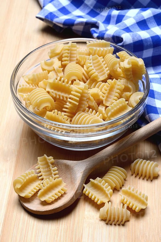 Italian pasta in a glass bowl, Radiatori variety