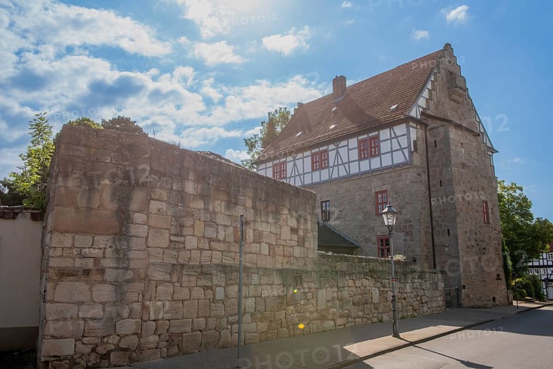 Restored Ratshof at the medieval town wall, Bad Sooden-Allendorf, district Allendorf, Steinernes Haus, former town hall, half-timbered house, lantern, street, backlight, blue sky, clouds, Werra-Meissner-Kreis, Hesse, Germany