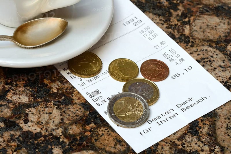 Tip, euro coins with receipt
