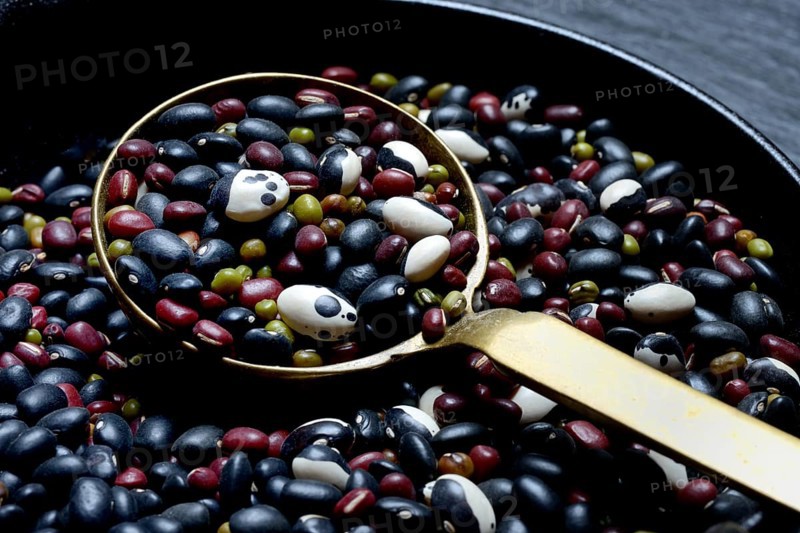 Various beans in ladle, dried beans