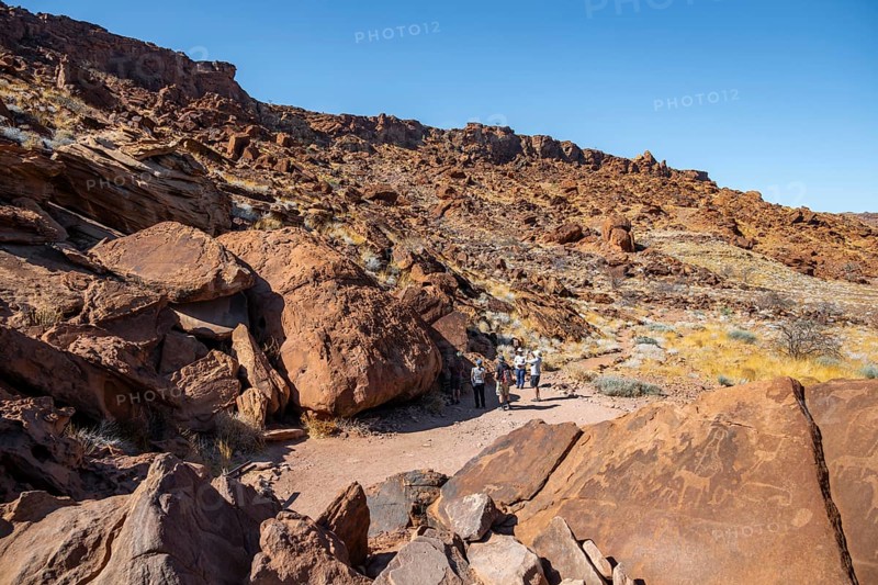 Tourists visiting the rock engravings of Twyfelfontein, Twyfelfontein, Kunene, Namibia