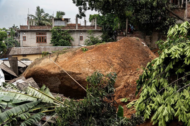 Large rock slides from the top of a hill and damaged houses in a major landslide, triggered by a heavy downpour, in Guwahati, India, on June 7, 2025. One person was reported missing in thr landslide and two houses damaged