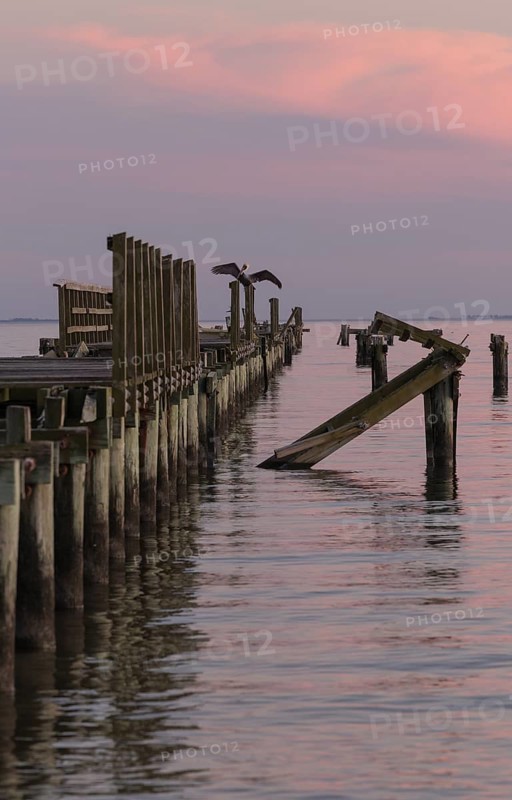 Dilapidated fishing pier damaged from hurricanes in Long Beach, Mississippi, USA