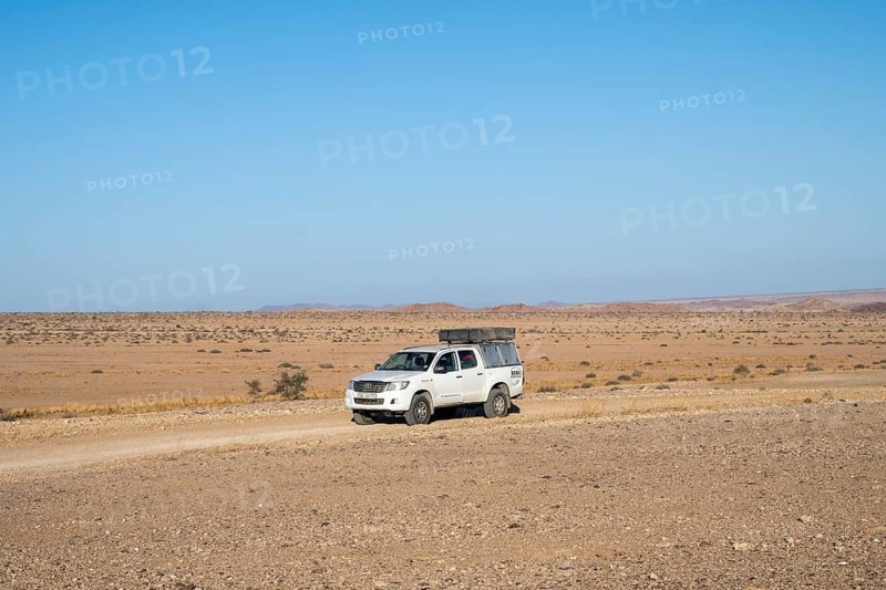 Off-road car on a sandy track, Brandberg, Damaraland, Namibia