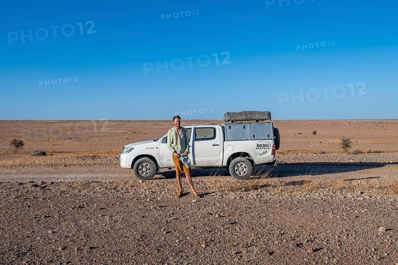 Tourist with off-road car on a sandy track, Brandberg, Damaraland, Namibia