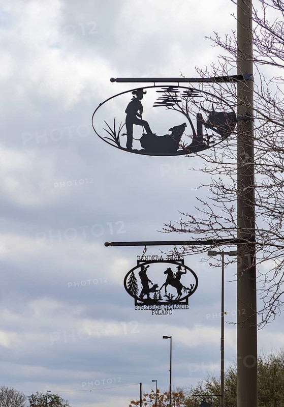 Artistic metal signs showing cowboy life on poles in Bandera, Texas, USA