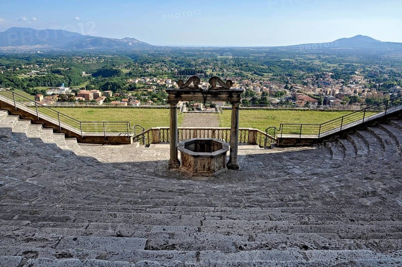 Fountain, draw well and flight of steps, rows of seats, auditorium, theatre of Roman antiquity at the baroque palace Palazzo Colonna Barberini, Palestrina, Campagna Romana, metropolitan city of Rome, Lazio, Italy