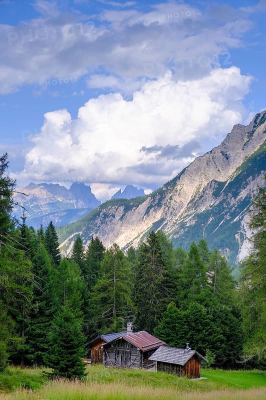 Alpine huts at Passo Cibiana, near Cibiana di Cadore, Dolomites, Trentino, Italy