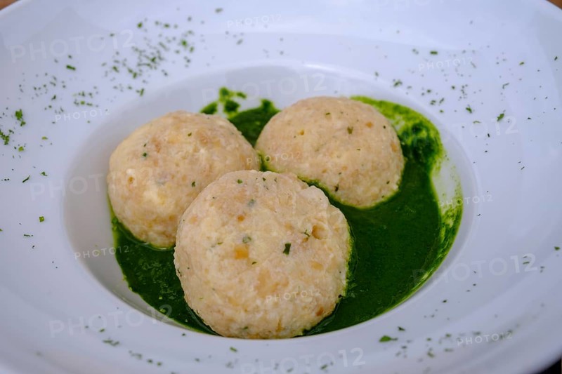 Dumplings on herbs, at Rifugio Ra Stua, Ra Stua Alm, Valon Scuro, near Cortina d'Ampezzo, Dolomites, Trentino, Italy