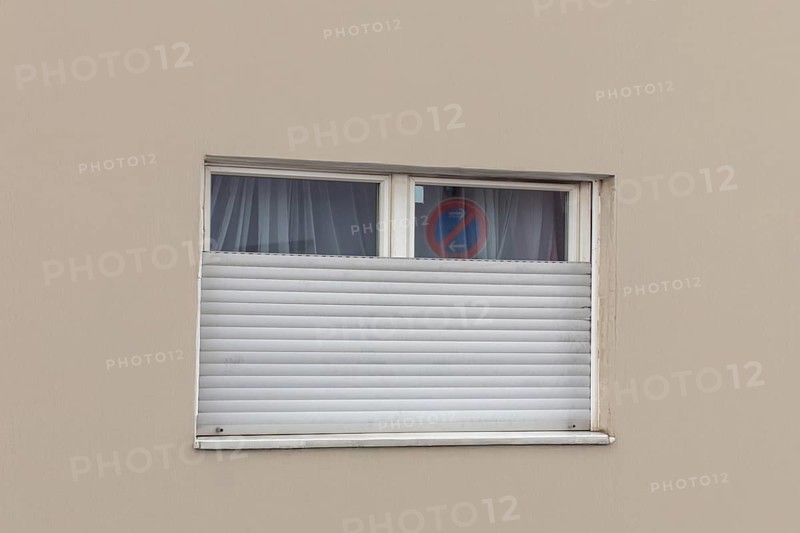 Broken roller shutter on a detached house