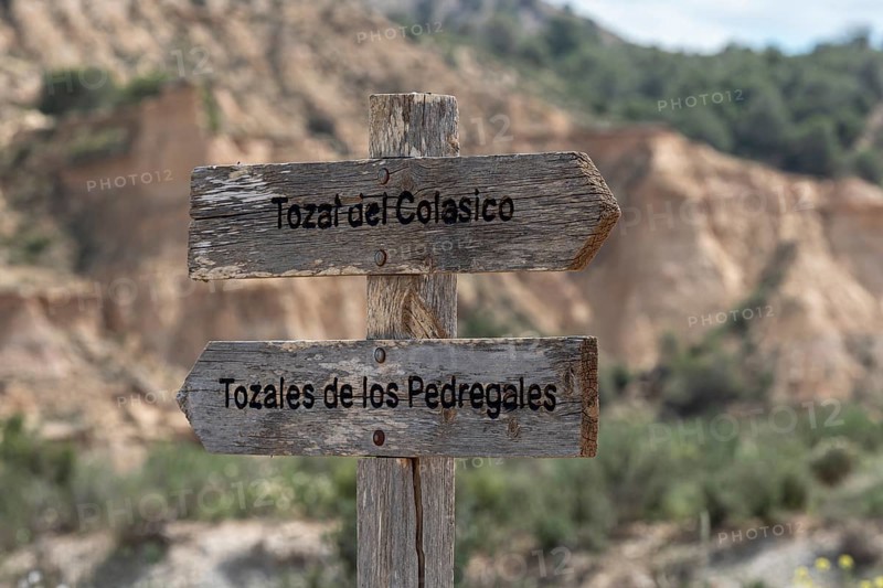 Signpost to sandstone rock formations, gravel road Ruta Jubierre, Desierto de los Monegros, Spain
