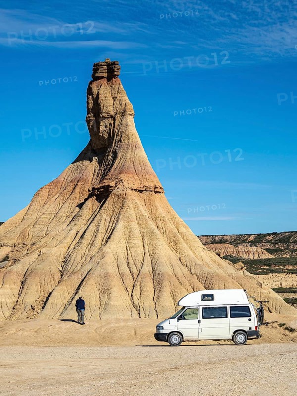 Camper van in front of Castildetierra rock formation, tourist, semi-desert, Bardena Blanca area, Bardenas Reales Nature Park, Navarre, Spain