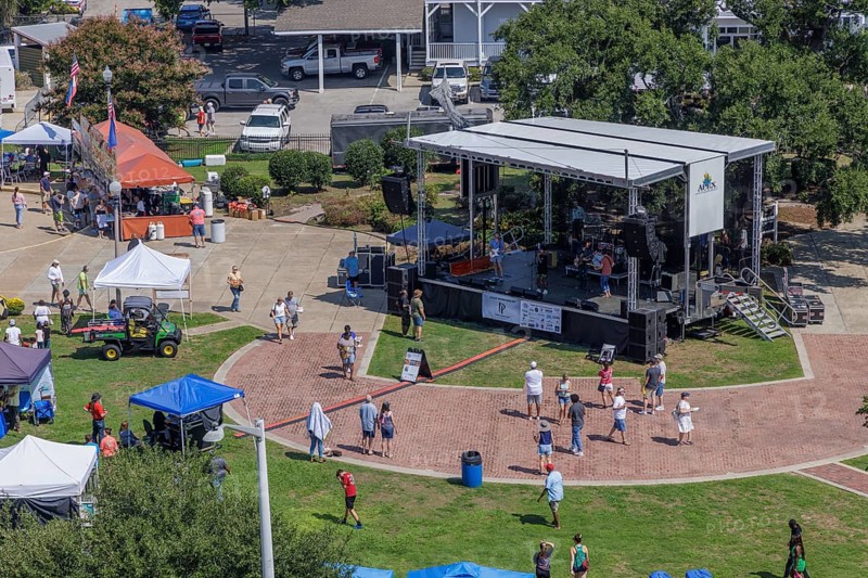Visitors being entertained with live music at the bandstand during the Biloxi Seafood Festival in Biloxi, Mississippi