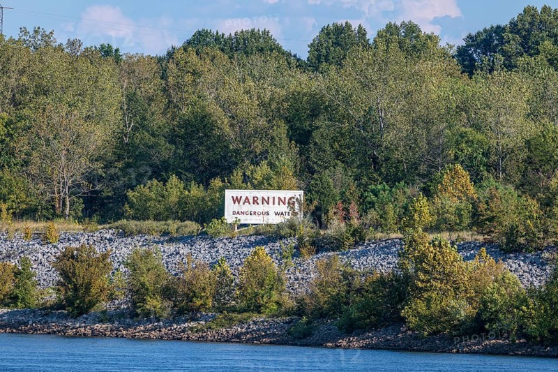 Sign warns of dangerous waters along the Tennessee River west of the Pickwick dam and locks near Counce, Tennessee