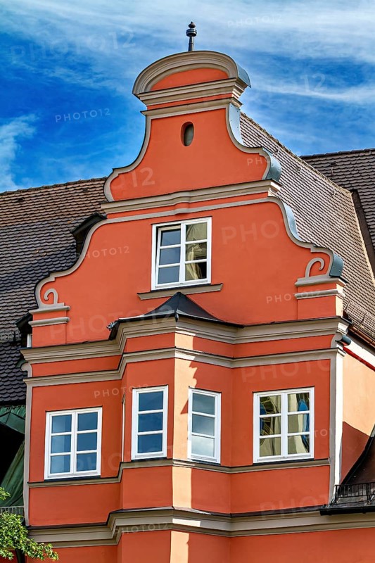 Orange-coloured baroque town house with decorative elements, The town of Kempten im Allgäu