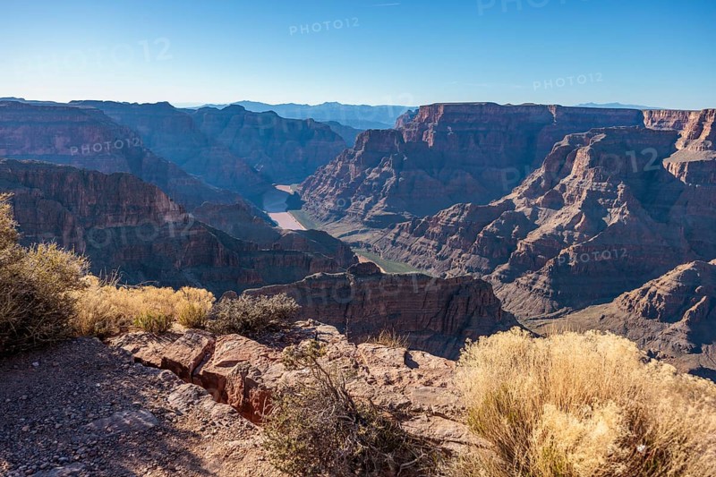 Colorado River runs between rock formations at Guano Point in Grand Canyon West near Peach Springs, Arizona