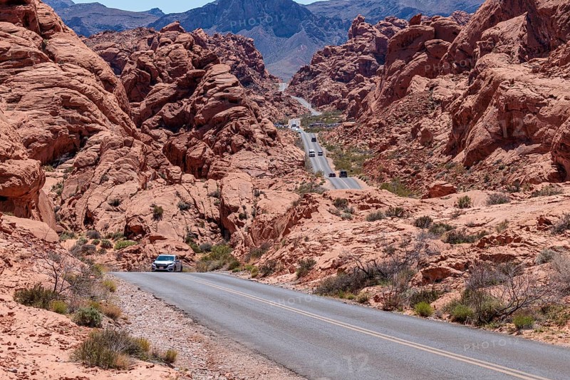 Traffic on Mouse's Tank Road winds between the red sandstone rock formations in Valley of Fire State Park near Overton, Nevada