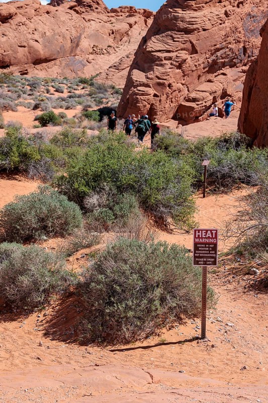 Sign at Fire Canyon Overlook Trailhead warns of hiking in hot weather at Valley of Fire State Park near Overton, Nevada
