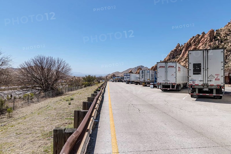 Semi trucks lined up at the Texas Canyon Rest Area on i-10 West near Dragoon, Arizona
