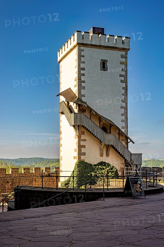 White watchtower with external staircase under a blue sky, Wartburg Castle near Eisenach in Thuringia
