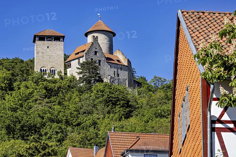 Historic castle with towers above a village with half-timbered houses and lots of greenery, Normannstein Castle near Treffurt in Thuringia