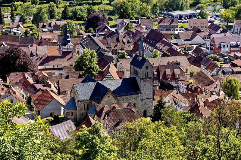 View of a picturesque village with old half-timbered houses and a central church in the countryside, The town of Treffurt in Thuringia