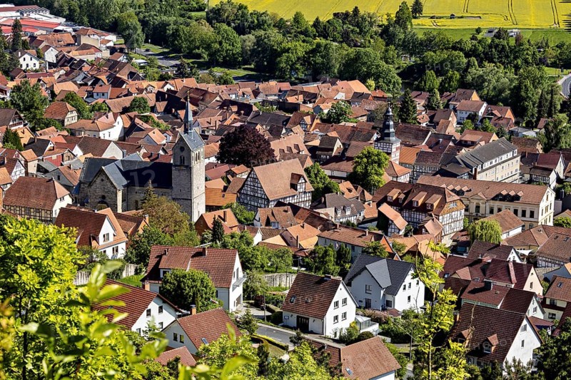 Panorama of a small town with a church, surrounded by fields and green countryside, The town of Treffurt in Thuringia