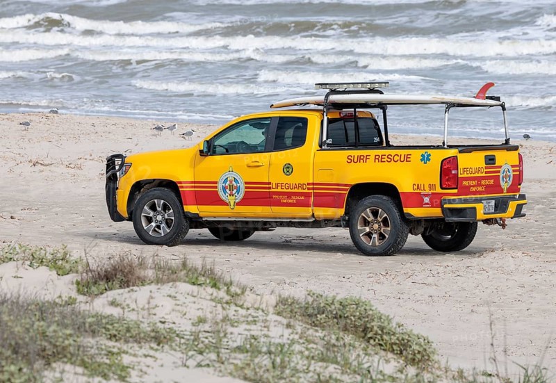 Galveston Island Beach Patrol truck on the beach of the Texas Gulf Coast at Galveston, Texas