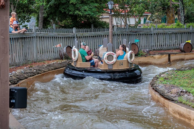 Park guests ride the Smoky Mountain River Rampage at the Dollywood amusement park in Pigeon Forge, TN