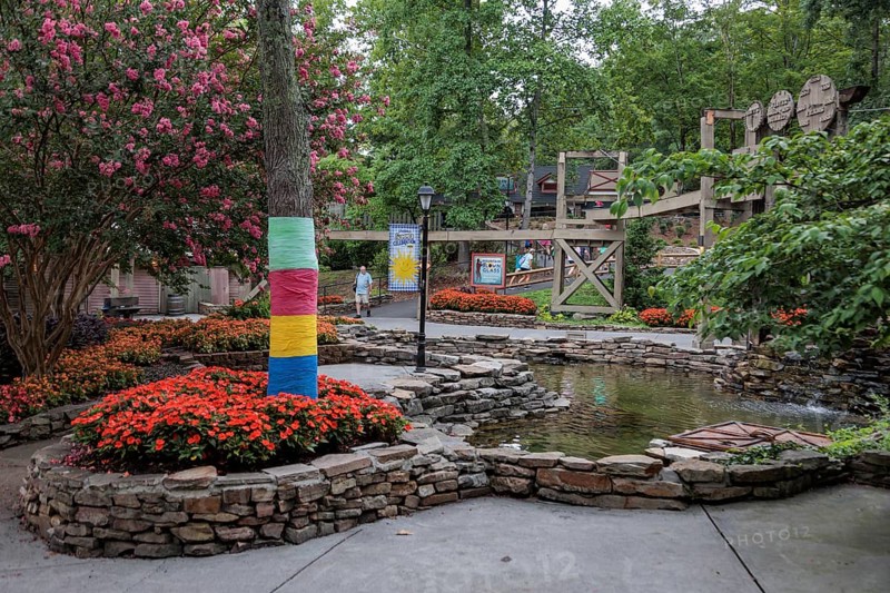 Immaculate landscaping with colorful flowers and water features at the Dollywood amusement park in Pigeon Forge, TN