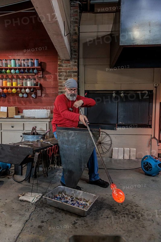 Glass blower demonstrates the art of blowing glass at the Dollywood amusement park in Pigeon Forge, TN