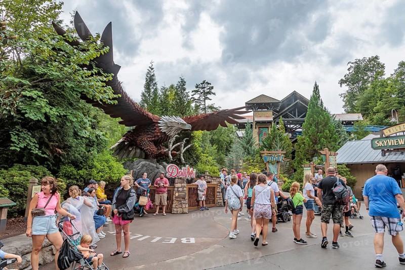 Park guests walk past a large steel sculpture of an eagle near the Wild Eagle wing roller coaster ride at the Dollywood amusement park in Pigeon Forge, TN