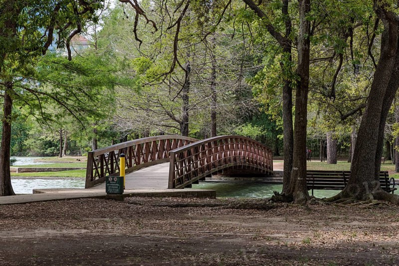 Pedestrian bridge over a part of McGovern Lake in Hermann Park in downtown Houston, Texas