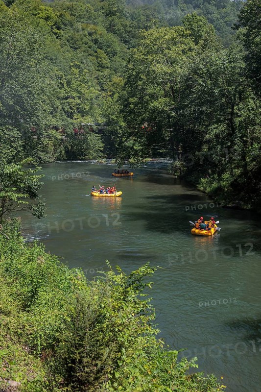 Rafters on the Nantahala River as seen from the Great Smoky Mountains Railroad which runs next to the river during its excursion from Bryson City, North Carolina