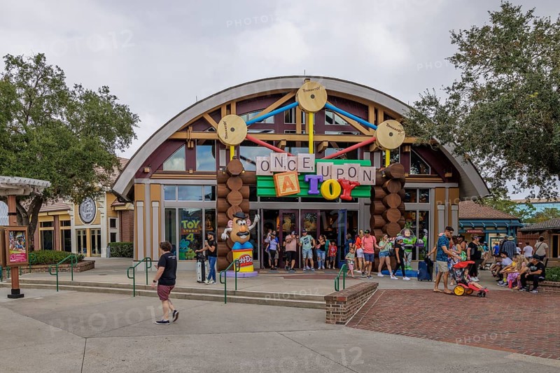 Shoppers and visitors walking past the Once Upon A Toy toy store in Downtown Disney at Disney World in Orlando, Florida, USA