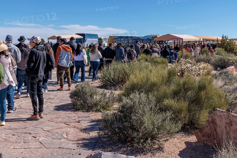 Visitors in line to take bus transportation from Eagle Point area too the Guano Point area of Grand Canyon West near Peach Springs, Arizona
