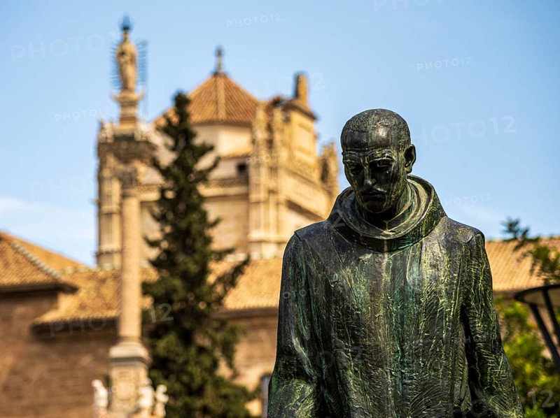 Statue of Johannes von Gott, Granada, royal hospital in the back, Granada, Andalusia, Spain