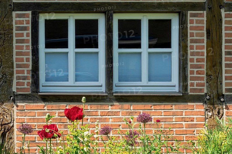 Half-timbered house façade with two small windows, district educational garden, Burgsteinfurt, North Rhine-Westphalia, Germany
